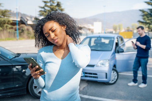 Woman On Phone After Car Accident - What To Do After a Car Accident