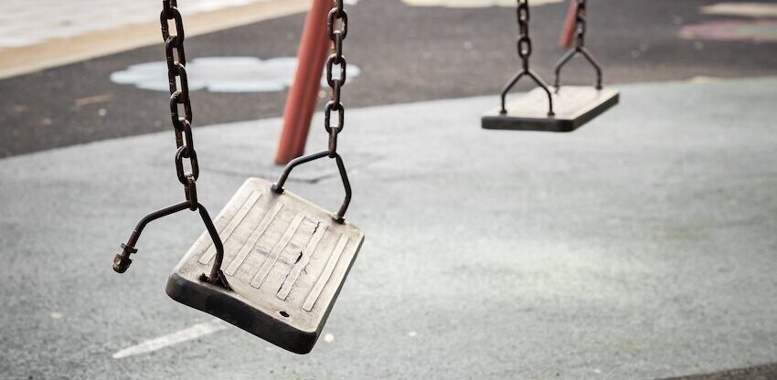 Unsafe playground swings represent the need for a premises liability lawyer.