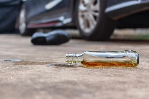 alcohol bottle at car crash where victim needs a DUI accident lawyer