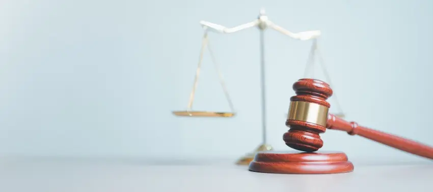 a wooden judge's gavel and scales of justice symbolize a personal injury claim, legal representation, and compensation rights in North Carolina at NC Injury Law.