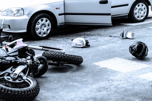 motorcycle accident with helmet and motorcycle on road