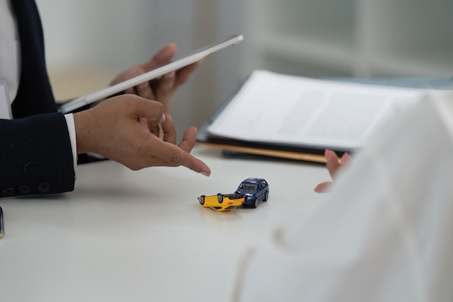 Wilmington car accident lawyer Thomas York at NC Injury Law reviewing a North Carolina car accident case file to counter insurance adjuster tactics and recover full compensation for an injured client