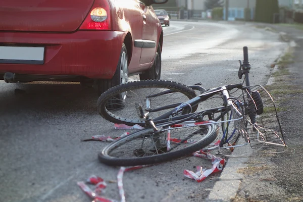 A bike hit by a car symbolizes a North Carolina bicycle accident lawyer.